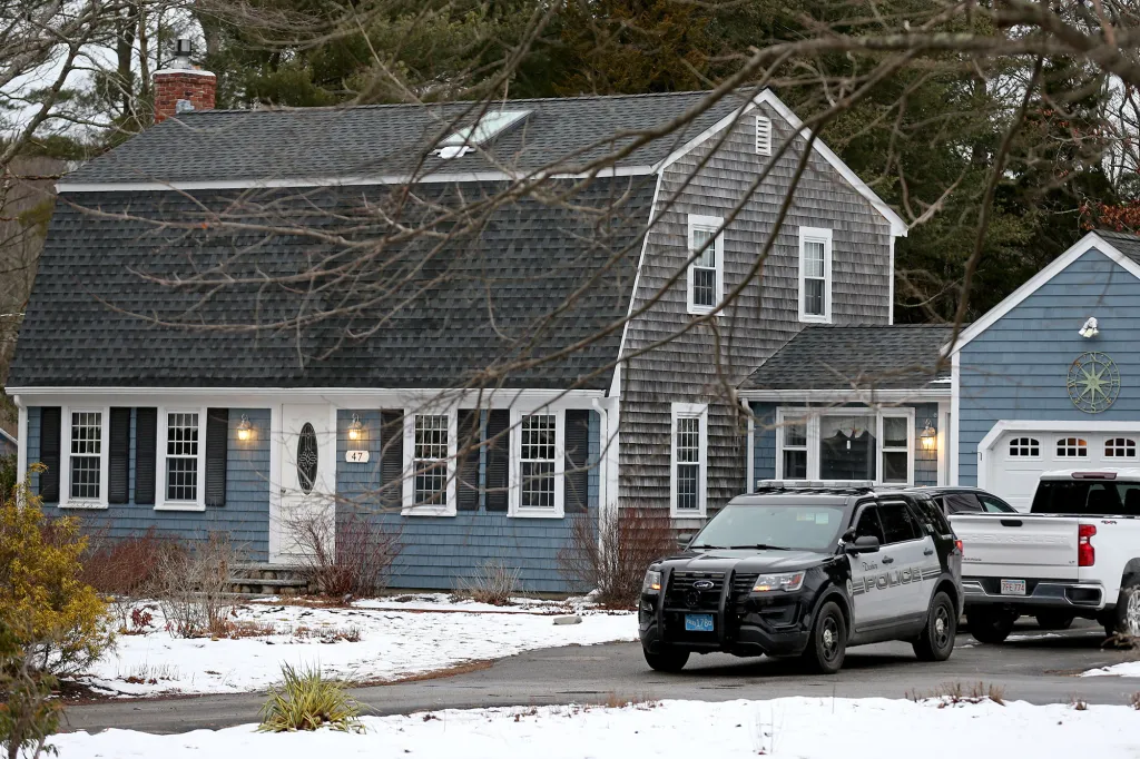 A police cruiser sits in the driveway at 47 Summer Street, the home of Lindsay Clancy, 32, who strangled her three children and then attempted suicide, January 25, 2023 in Duxbury, Massachusetts.